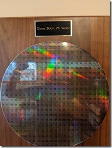 Self-portrait of author, reflected in CPU wafer
